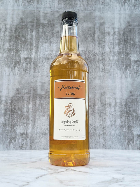 Hazelnut Syrup 1lt bottle, front view with label.
