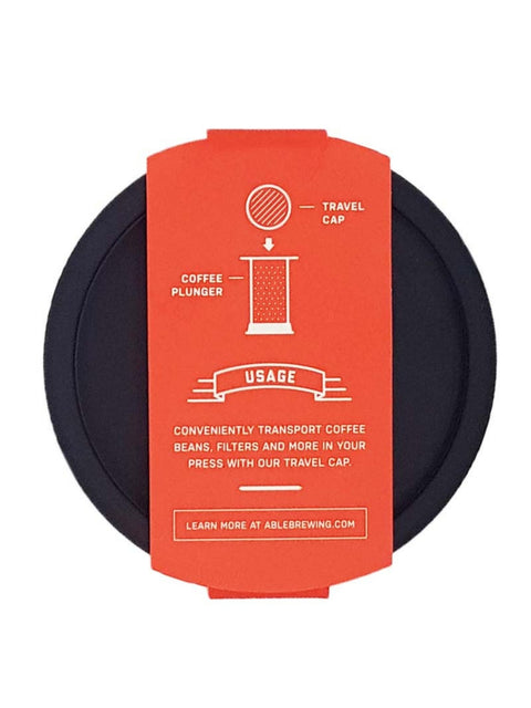 Travel cap for transporting coffee beans, filters, and more inside the AeroPress.