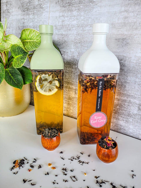 Hario ice tea makers in white and green with rose earl grey and lemon green tea brewing.