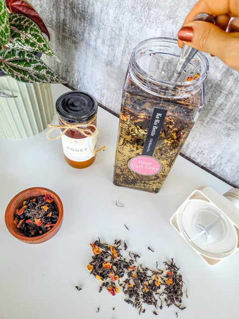 Hario ice tea makers in white with rose earl grey tea brewing and Sipping Duck honey jar.