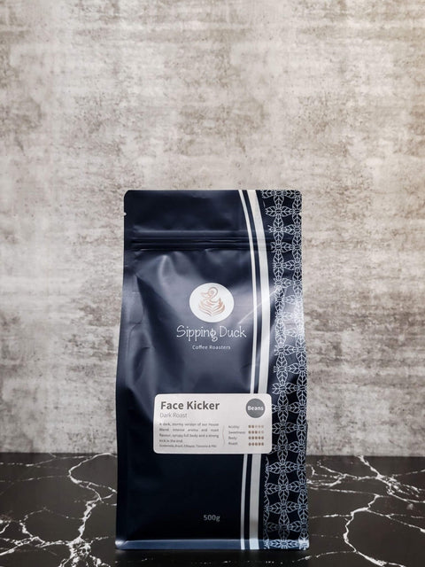 Sipping Duck Specialty Coffee Roasters Face Kicker Blend, dark roast in 500g blue bag with profile description and unique pattern.