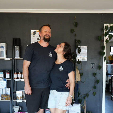 Fi and Lance from Sipping Duck laughing and hugging at Bungalow cafe.