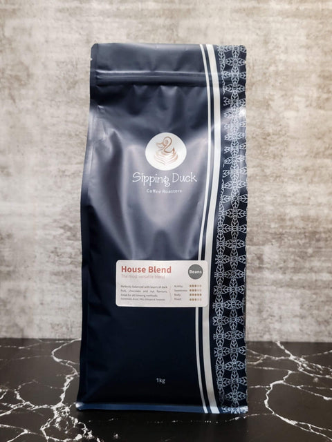 Sipping Duck Specialty Coffee Roasters House Blend 1kg bag, blue with unique pattern.