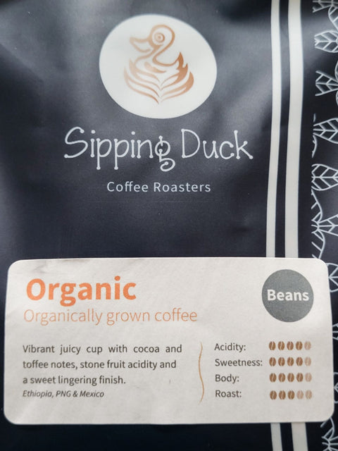 Sipping Duck Coffee Roasters Organic blend description label.