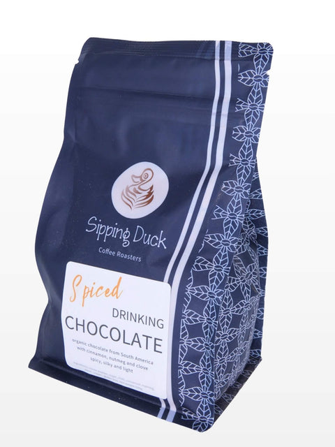 Sipping Duck organic spiced drinking chocolate bag with label and ingredient list.